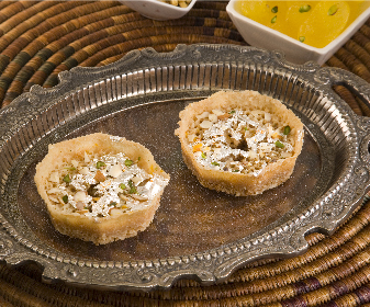 Ghewar is a traditional Rajasthani sweet that is relished during all traditional festivals. It is a disc-shaped dish made from oil, flour and sugar syrup. 